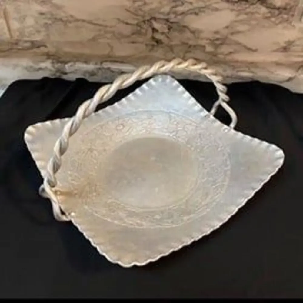 * hand-forged hammered aluminum basket engraved floral bouquet twisted handle